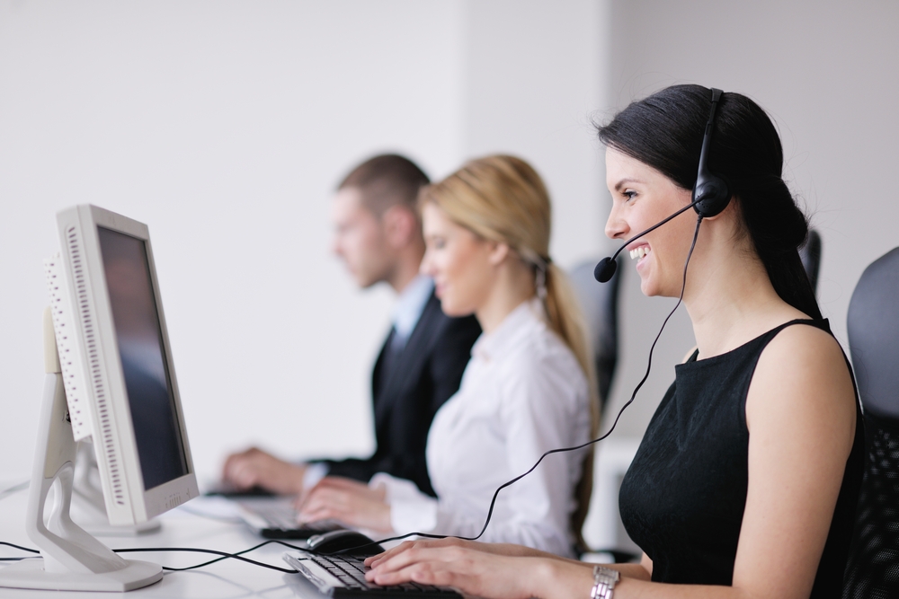 business people group with  headphones giving support in  help desk office to customers, manager giving training and education instructions